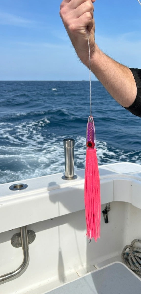 Lifestyle photo of Epic Fishing Co Axis Junior wahoo lure offshore on boat