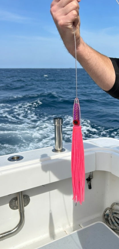 Lifestyle photo of Epic Fishing Co Axis Junior wahoo lure offshore on boat