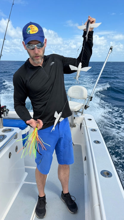 Epic Fishing Co. Squid & Flaps Dredge held on boat